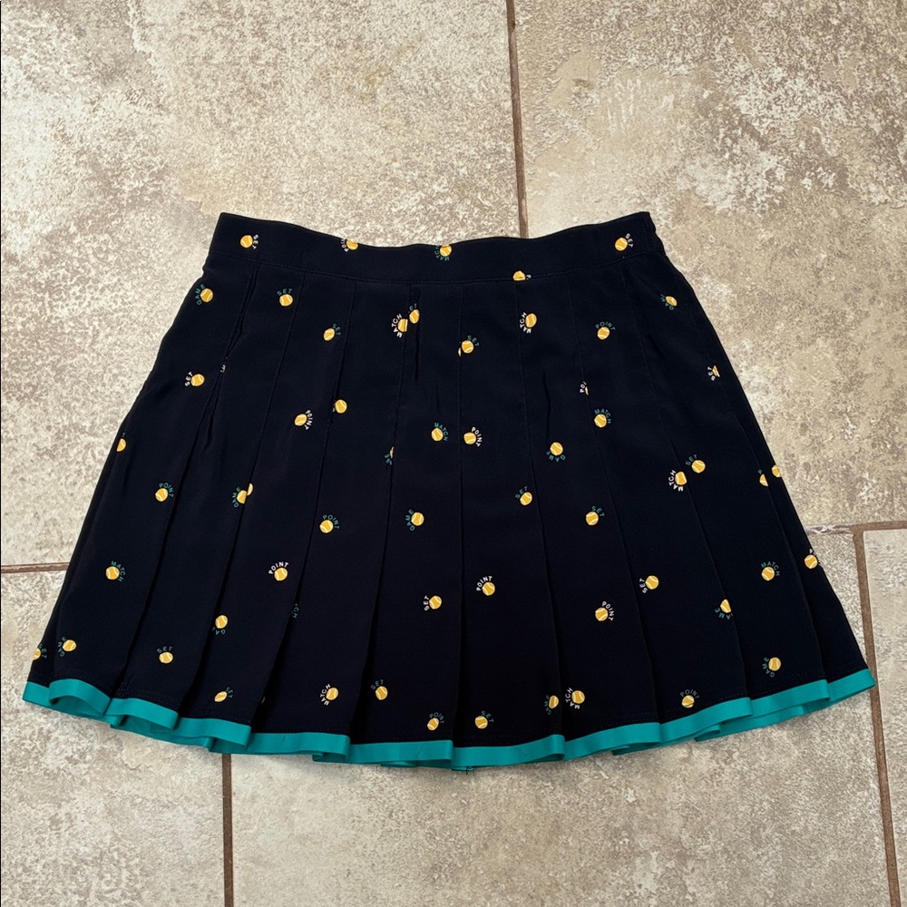 Tail Pleated Tennis Skirt with Yellow Tennis Ball design and Teal Trim